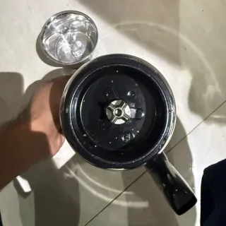 Walton Megatron WBL-15G417 stainless steel grinding jar with handle beside the small chutney jar